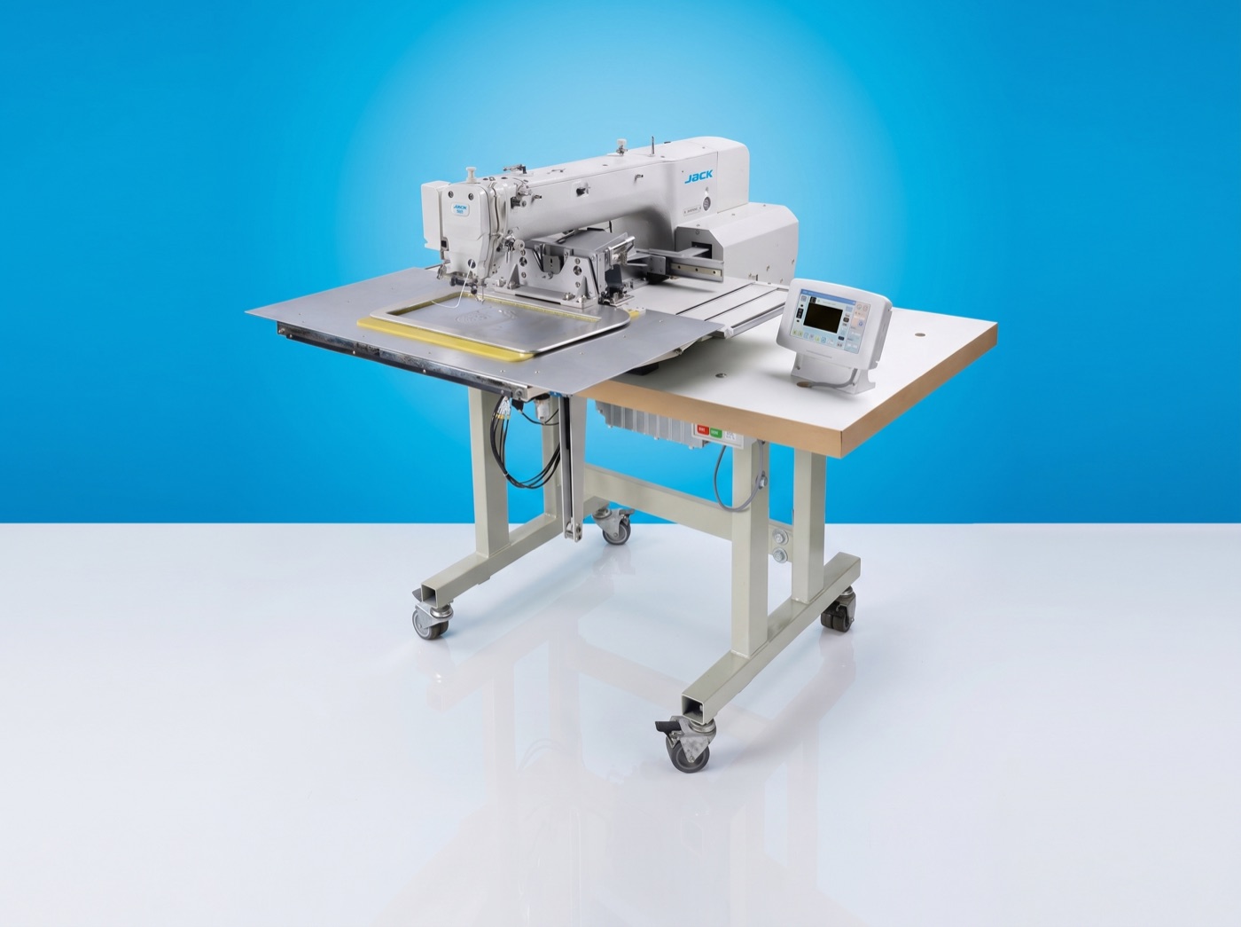 Jack programmable pattern-sewing industrial machine on a vivid azure panel