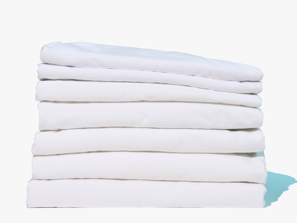Stack of folded knit jersey t-shirts