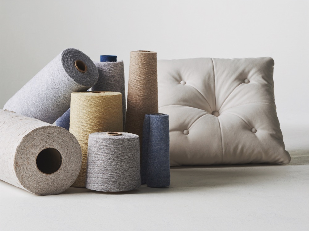 Rolled upholstery fabric and a tufted cushion